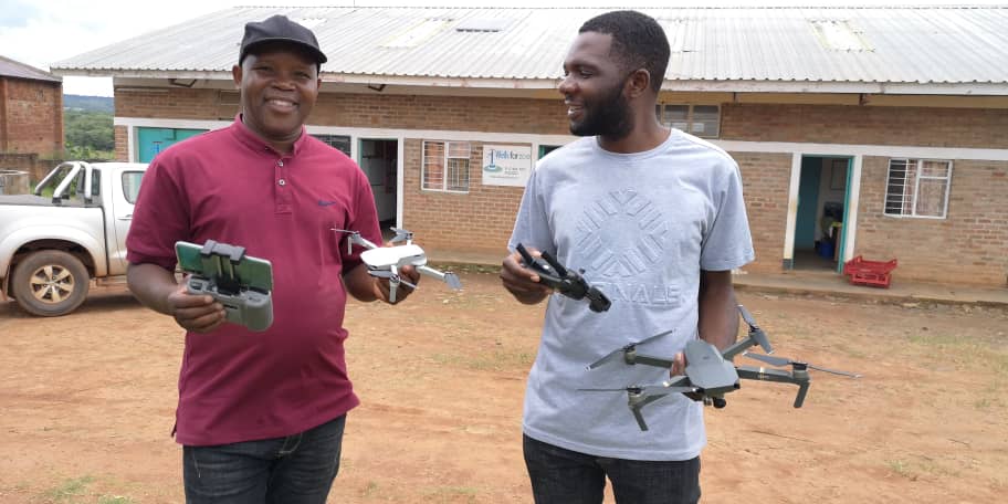 Harisen & Lovemore with dji drones outside WfZ offices